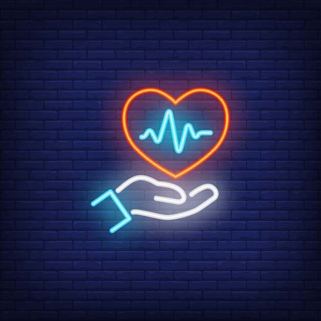 Hand holding heart with cardiogram neon sign