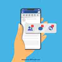 Free vector hand holding phone with facebook notifications