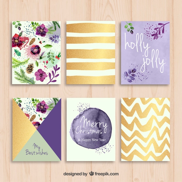 Free vector hand painted christmas cards in purple and golden tones