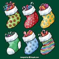 Бесплатное векторное изображение Ручная роспись рождественские носки