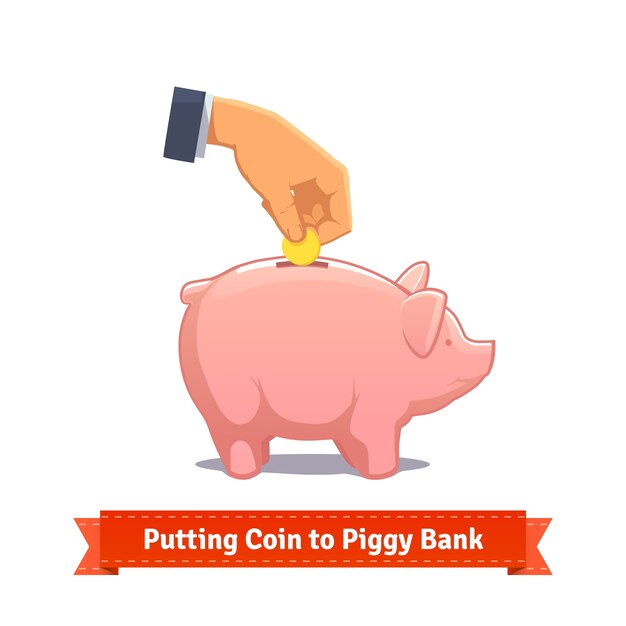 Hand putting coin to a pink piggy bank
