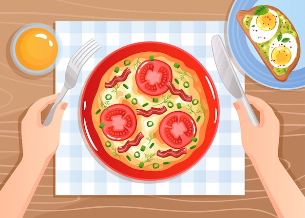 평평한 나무 테이블에 토마토와 베이컨 스크램블 계란 칼 붙이 손