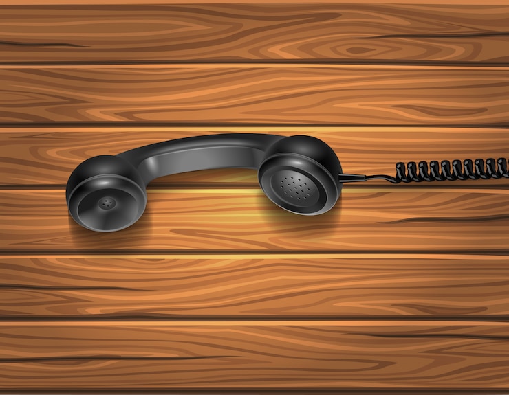 Free Vector handset on wooden background
