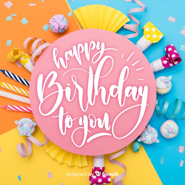 Free vector happy birthday lettering with cake