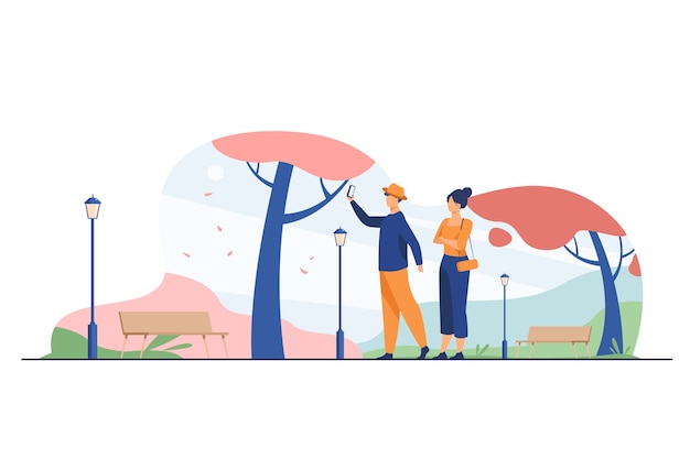 Happy couple taking selfie in autumn park. fall, love, season flat vector illustration. date and weekend