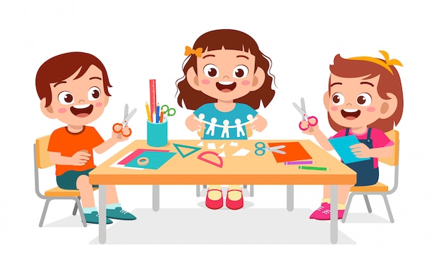 Happy cute little kids boy and girl make paper craft