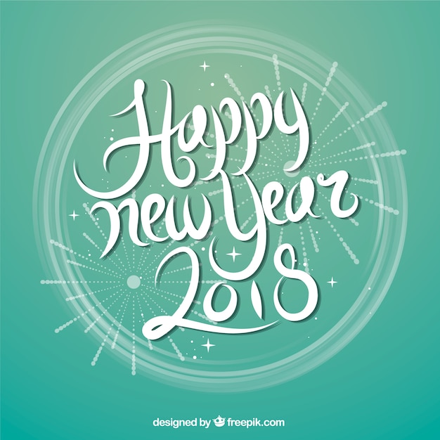 Happy new year in white lettering on a turquoise background