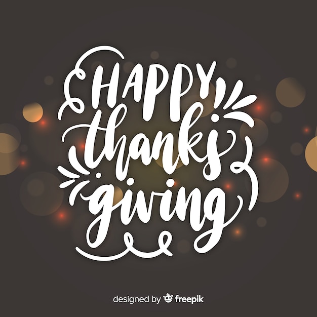 Happy thanksgiving lettering on blurred background