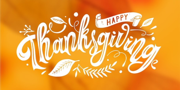 Happy thanksgiving lettering on blurred background