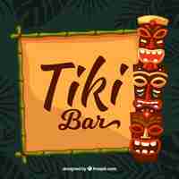 Free vector happy tiki masks and bamboo frame