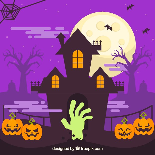 Haunted house background with pumpkins and zombie hand