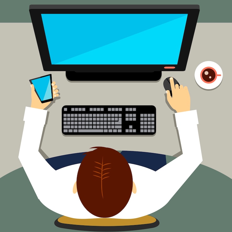 Free Vector high-angle of a man sitting in the office and working on a desktop computer