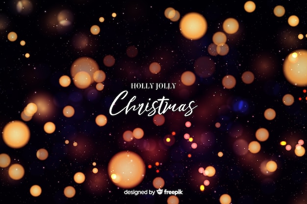 Free vector holly jolly christmas bokeh background