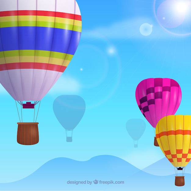 Free vector hot air balloons background in the sky with clouds