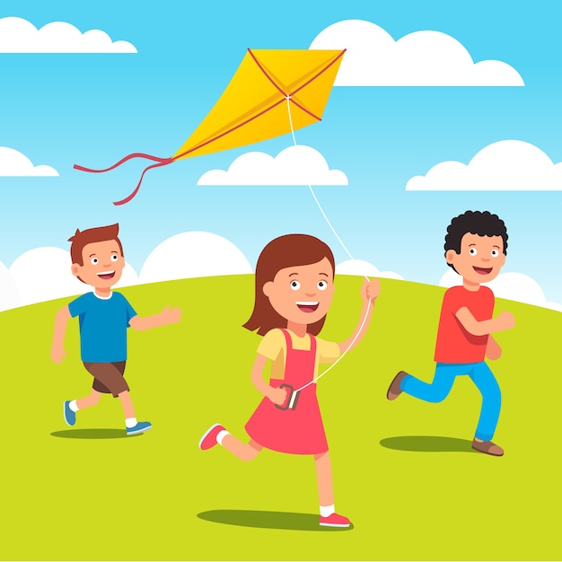 草原で凧を一緒に遊んでいる子供たち