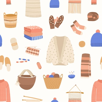 ニット​アイテム​は​シームレス​な​パターン​を​ベクトル​します​。​キュート​で​暖かい​冬​の​服​の​背景​。​ウール​の​かせ​、​編み針​、​糸​かご​、​ウール​の​ジャンパー​、​手作り​の​スカーフ​、​カーディガン​。​ニット​ウェア​の​背景​。