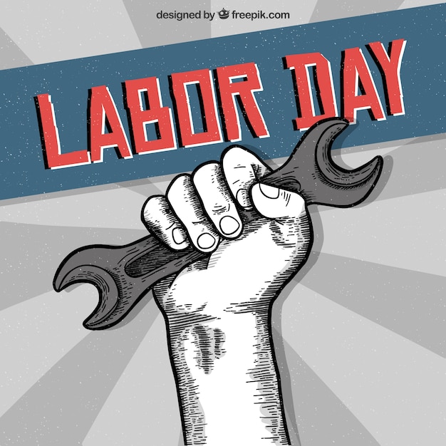 Free vector labor day background with hand holding tool