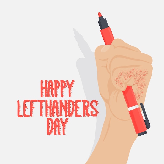 Left handers day with hand holding pen