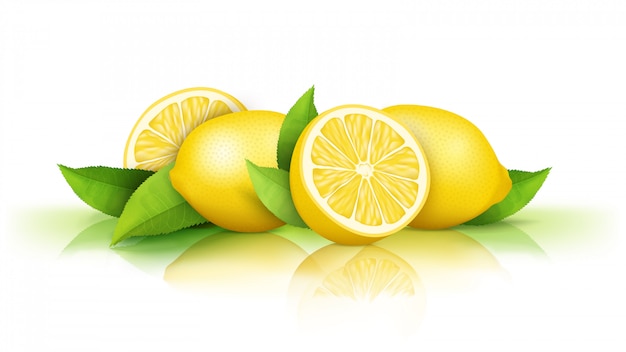 Лимоны и зеленые листья на белом