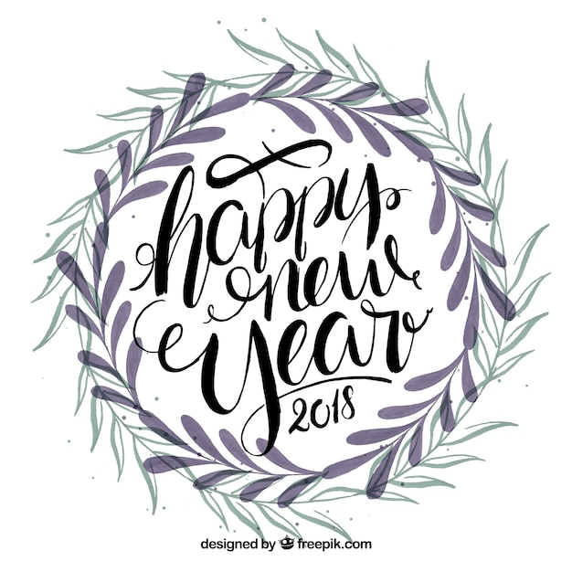 Lettering happy new year 2018 with leaves crown