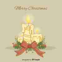 Free vector lit christmas candles with bow