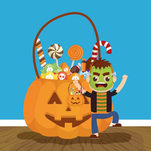 Free vector little boy with frankenstein disguise and candies pumpkin