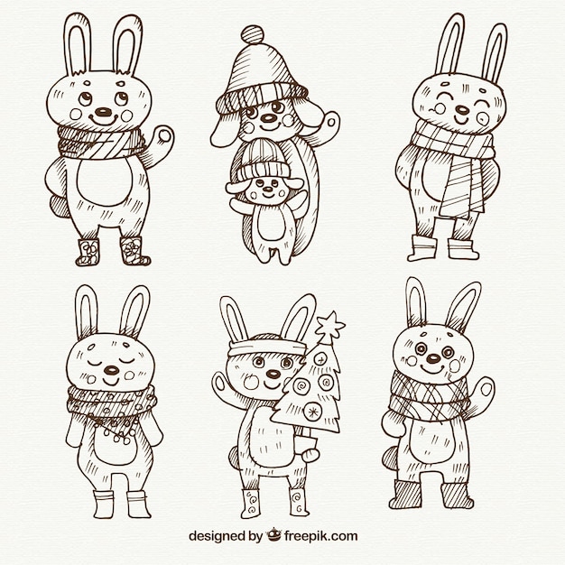 Free vector lovely bunnies collection of hand drawn with winter clothes