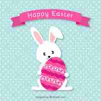 Free vector lovely easter bunny with decorated egg