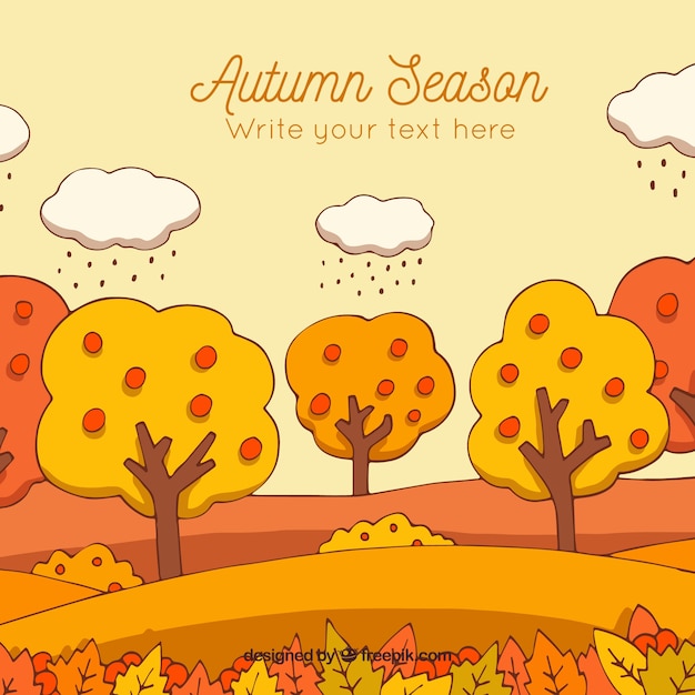 Free vector lovely hand drawn autumnal landscape background