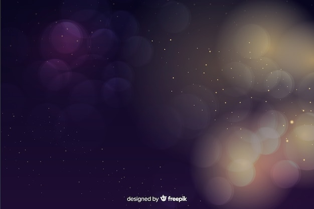 Free vector luxury background with golden and blue particles bokeh
