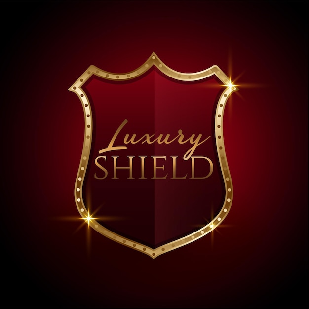 Luxury golden shield symbol design in red colors