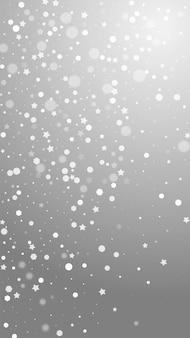 魔法​の​星​ランダムな​クリスマス​の​背景​。​灰色​の​背景​に​微妙な​空​飛ぶ​雪​の​結晶​と​星​。​面白い​冬​の​シルバースノーフレークオーバーレイテンプレート​。​生き生き​と​した​縦​の​イラスト​。
