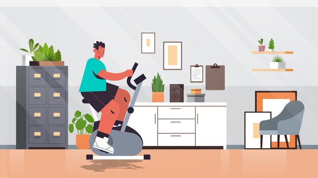 Premium Vector Man Riding Stationary Bike At Home Guy Having Workout Cardio Fitness Training Healthy Lifestyle Sport Concept Living Room Interior Full Length Illustration