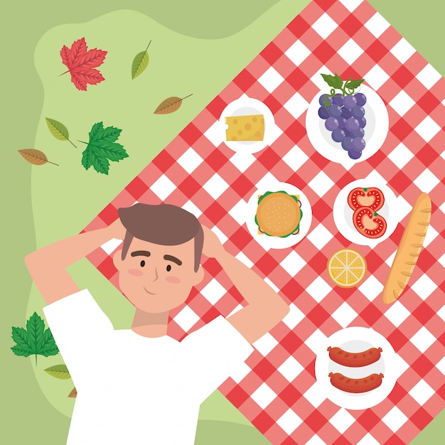 Man with grapes and snack food in the tablecloth