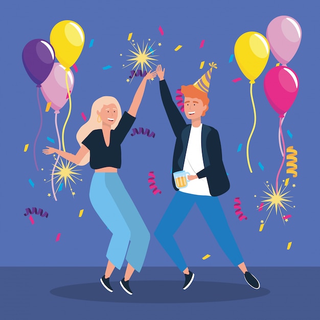 Man and woman dancing with balloons and sparklers fireworks