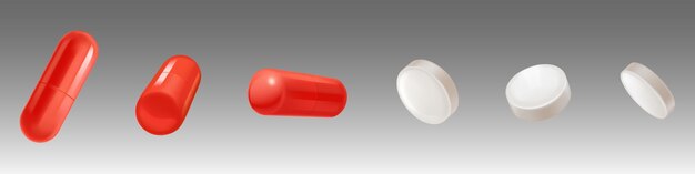 Медицинские препараты белые таблетки и красные капсулы
