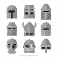 Free vector medieval helmets with flat design