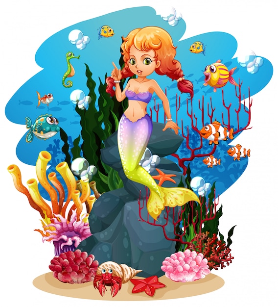 Sirena e molti pesci nell'oceano