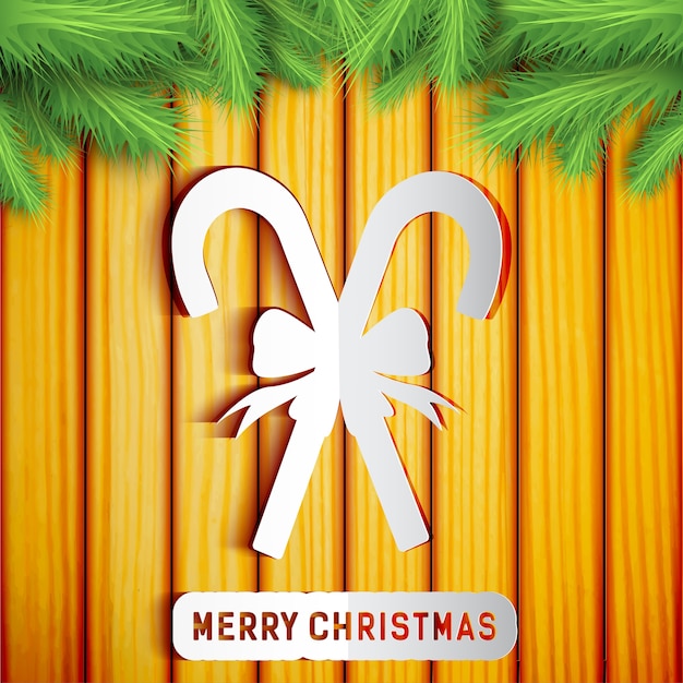Веселая рождественская открытка с силуэтом леденцов на деревянной стене с еловыми ветками