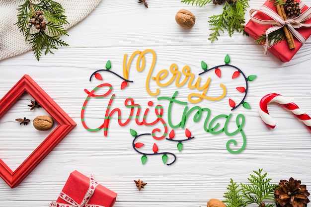 Free vector merry christmas lettering with frame and presents