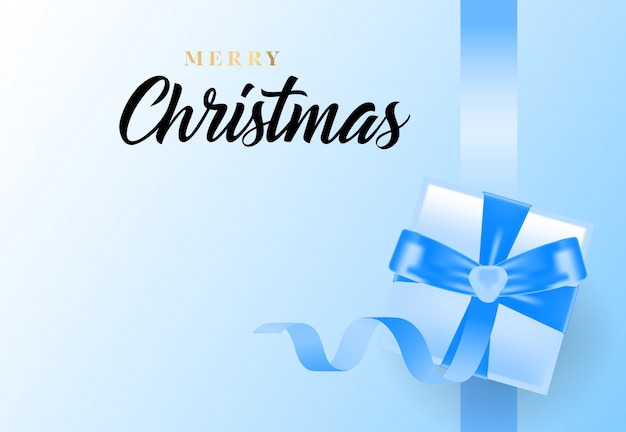 Free vector merry christmas lettering with ribbon and gift box