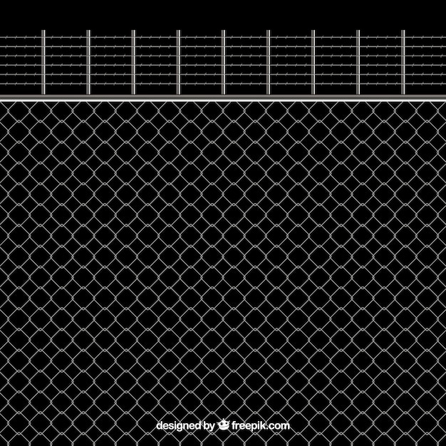 Metal fence with barbed wire on black background