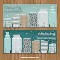 Free vector modern city banners with skyscrapers in winter