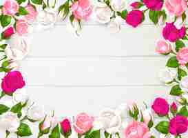 Free vector mothers day frame with pink white and fuchsia colors of roses on white wooden background  illustration