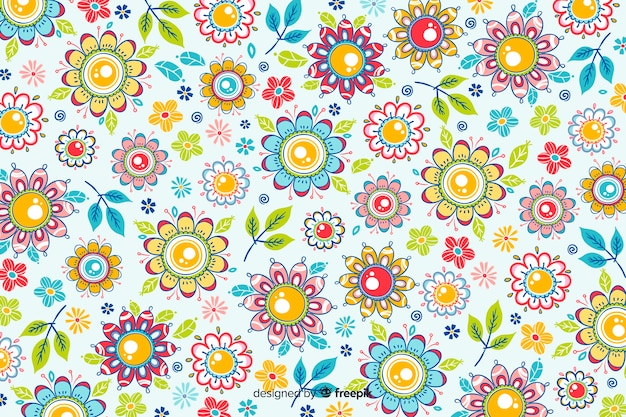 Free vector natural background with hand drawn flowers