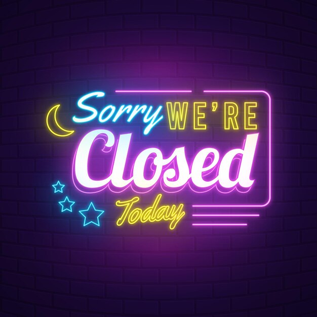 Neon 'sorry we are closed' sign on brick wall