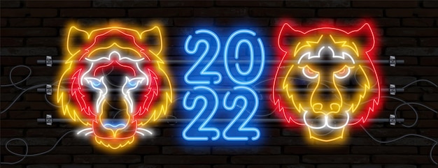 Neon tiger 2022 number icon. happy new year of the blue water tiger. orange neon style on black background. light icon