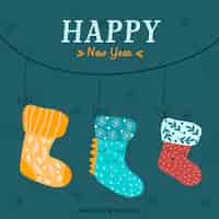 Free vector new year background with cute hand drawn socks
