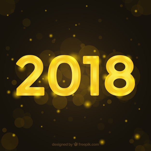 Free vector new year golden background with bokeh effect