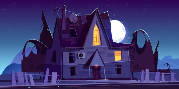 Old scary house with glow windows at night. cartoon landscape with spooky wooden mansion, broken fence, dark silhouettes of trees and moon in sky.